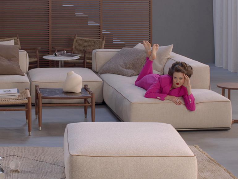 Lindsey Wixson posing on the Perry sofa